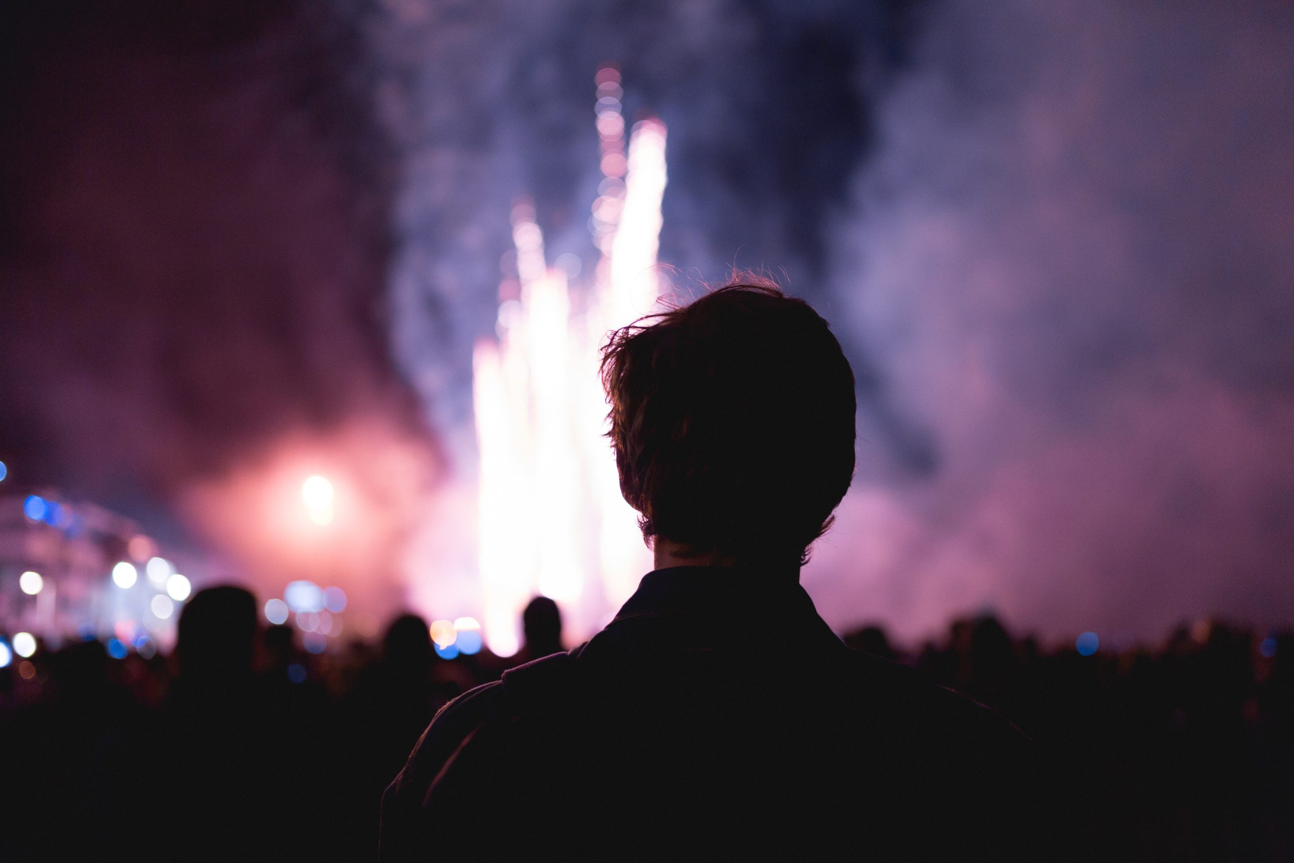 man looking at fireworks, thinking abiout the year of new content.
